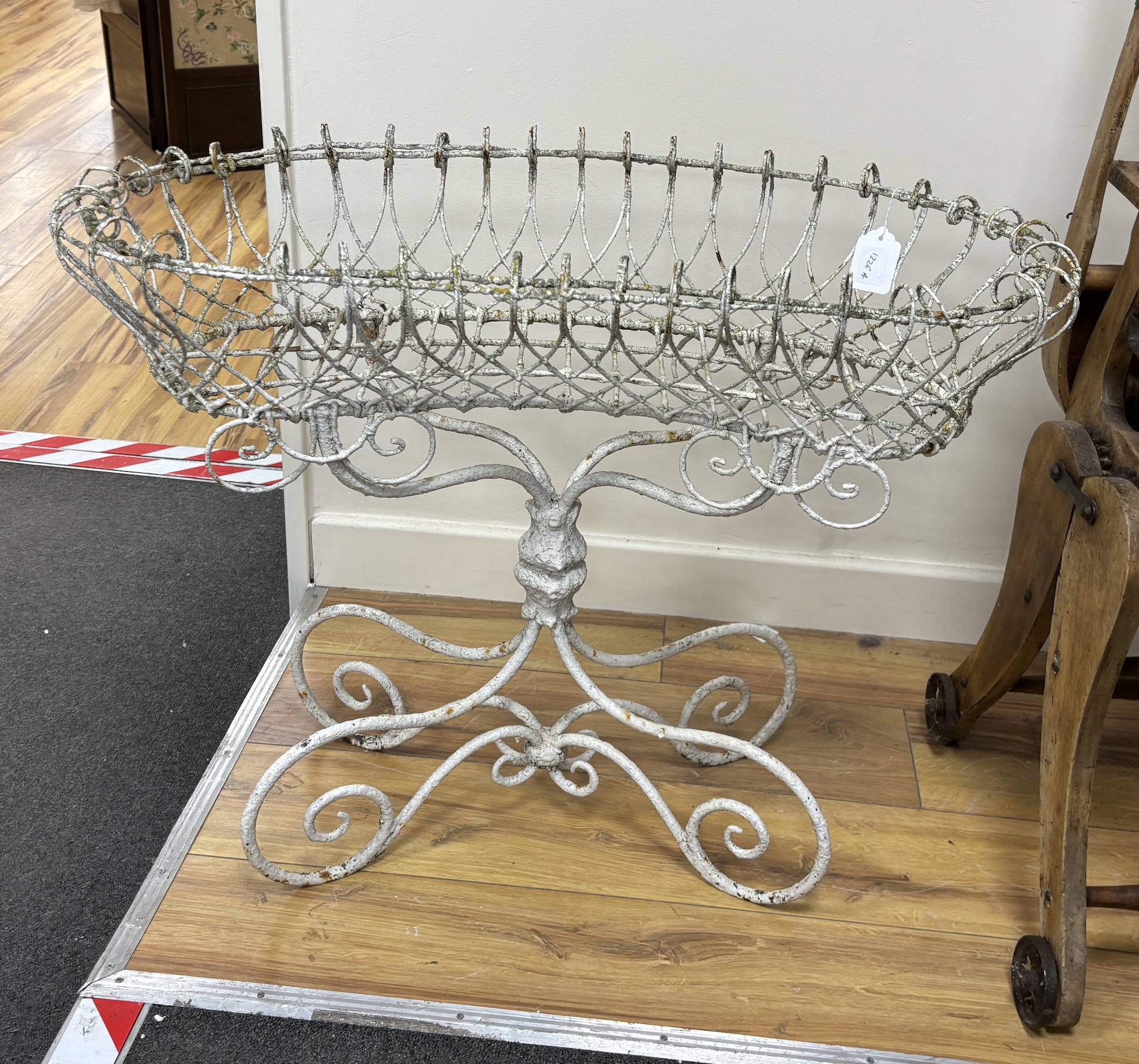 A Victorian painted wirework pot stand, width 76cm, depth 30cm, height 62cm